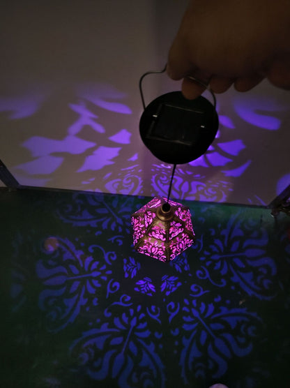 Solar iron hollow projection lamp